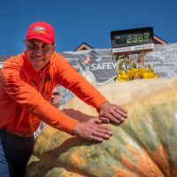 Winner Travis Gienger shows his Championship Rings with 2026 winning pumpkin