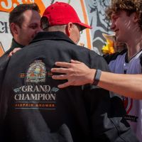 Winner Travis Gienger congratulated by other growers